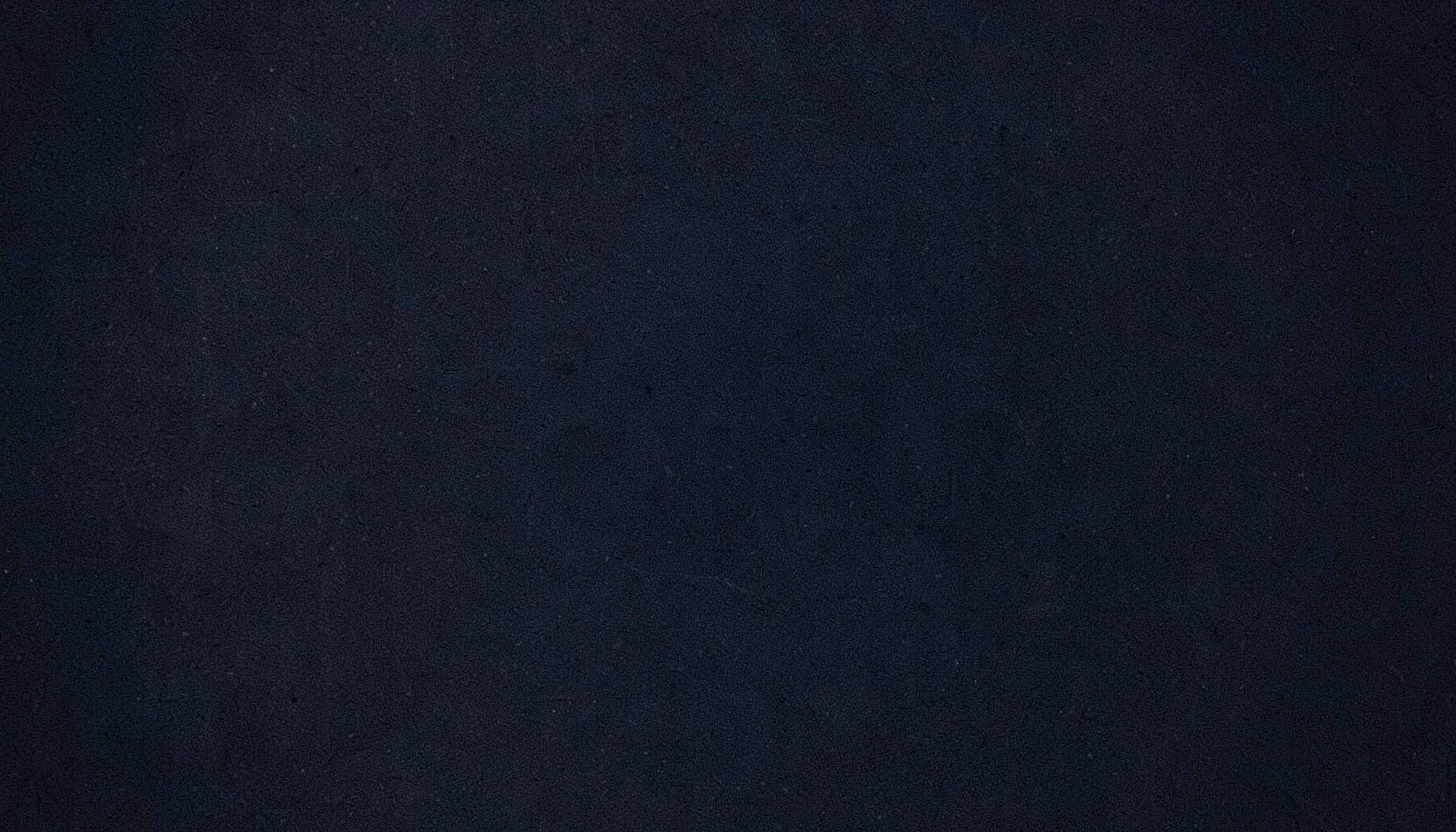 Abstract dark textured background with subtle grain, deep navy and charcoal tones